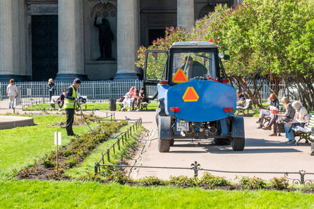 Watering flower beds by city improvement workers in the center in St. Petersburg, Russia. 2022のeditorial素材