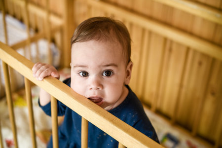 A little girl in a crib