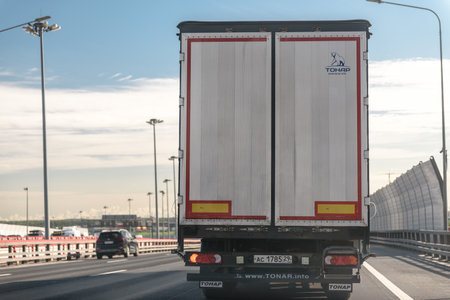 Russia, St. Petersburg, October 2023: the movement of trucks on the highway outside the cityのeditorial素材