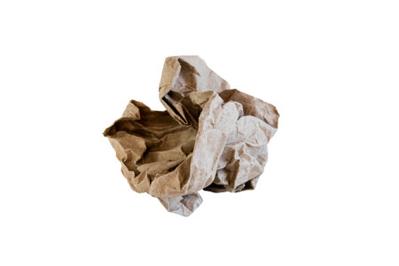 Craft paper crumpled lump on white isolated backgroundの写真素材