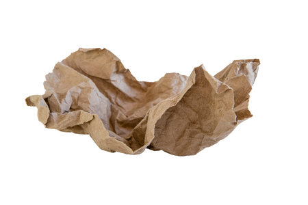 Craft paper crumpled lump on white isolated backgroundの写真素材