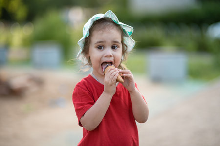 Close-up portrait of a child with ice creamの写真素材