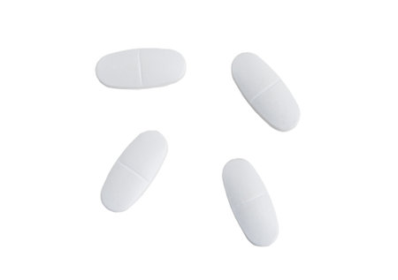 White pills on a white isolated backgroundの写真素材