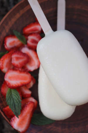 Strawberry. Strawberry ice cream in white chocolate glaze. selective focus