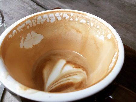 Close up stain hot coffee in cupの素材