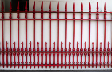 Railing red on wall white in thailandの写真素材