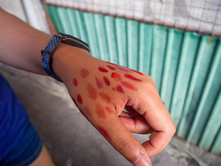 Test the color of cosmetics on the hand,Wang Lang Market,Bangkok,Thailandの写真素材