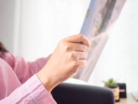 Woman reading a book, concepts of home and comfort