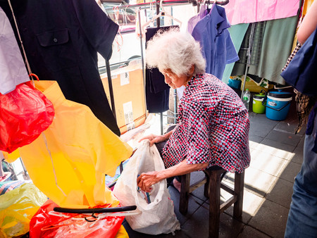 Grandma sells clothes in the market at (Sampeng)のeditorial素材