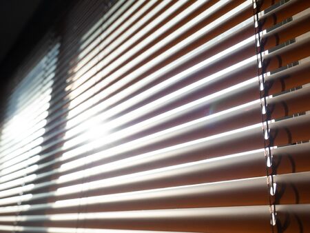 Blinds,Interior room decoration in living with sunlight,Material plastic brown,back groundの写真素材