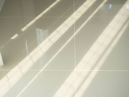 Sunlight on tiled floor,Sun pass Curtain,Material white ,Back ground,Morningの写真素材