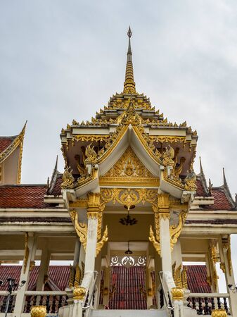 Crematory architecture style Thai with details texture is beautiful golden in temple name is Wat kaew at Bangkok Thailand, In date sky cloudyの写真素材
