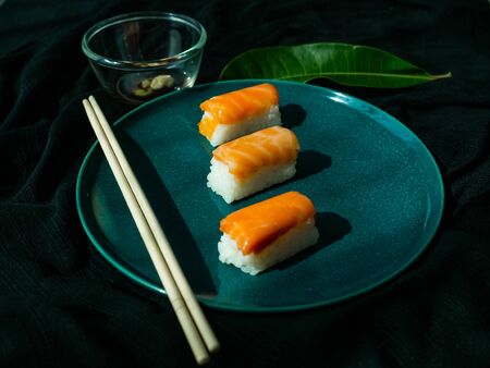Sushi set on dish with Salmon, Japanese food is good health, Color black background, Black cloth foundationの写真素材