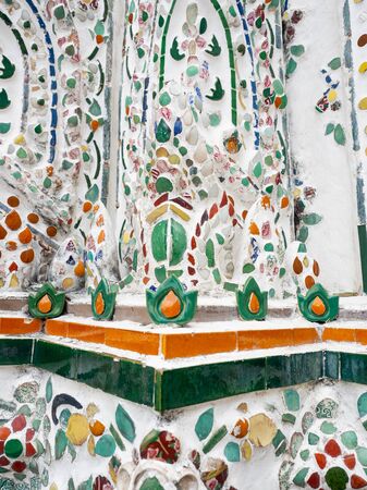 Sculpture from tiles is colorful,Pattern as Flower design Thai style,Temple name is Wat Arun Ratchawararam Woramahaviharn at Bangkok Thailandの写真素材