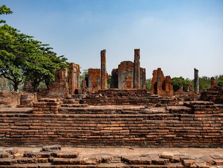 Thai architecture Ancient times,Most materials are brick and mortar,forming a wall and floor,The surrounding area has a beautiful Buddha statue,On the bright dayの写真素材