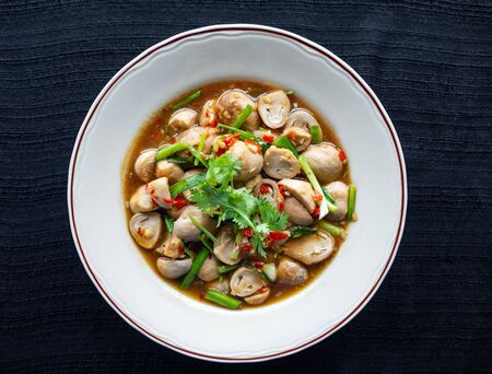 Stir Fried Straw Mushroom,Ingredients chili, garlic, spring onions topped with coriander,Taste Spicy, sweet, salty Is a healthy food and a weight loss menuの写真素材