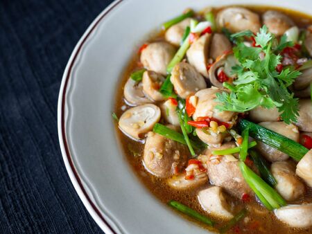 Stir Fried Straw Mushroom,Ingredients chili, garlic, spring onions topped with coriander,Taste Spicy, sweet, salty Is a healthy food and a weight loss menuの写真素材