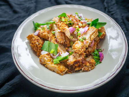Thai food Spicy Chicken Salad is a favorite of locals in Thailand. You can find it in the street food stalls. Using fried chicken as a stapleの写真素材