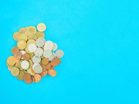 Savings that are stacked in layers With gold coin and silver coin Blue background