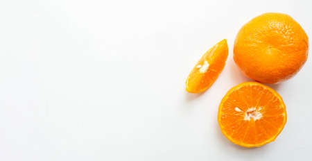 Orange fruits turned into full-size sets, half cubes, and halves. Show a fine pattern of orange skin Slices of orange pulp White background.Copy spaceの写真素材