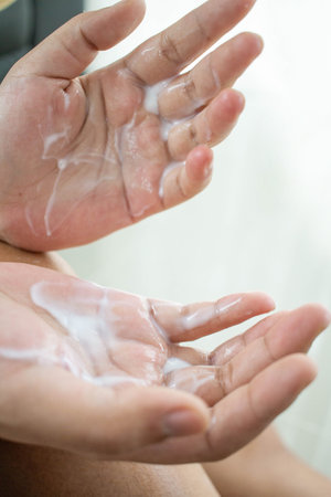 Woman squeezing cream on her hand Preparing to apply the skin