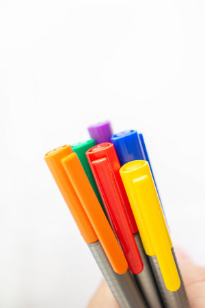 A man holding a rainbow pen in his hand For the expression of LGBT gayの写真素材