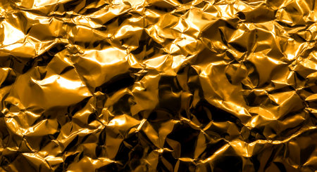 Gold foil texture background. Close up of gold foil texture background.の素材