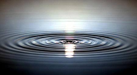 Water drop and ripples on water surface with ripples and wavesの素材