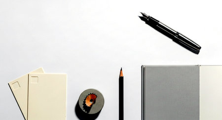 Pencil, notebook and eraser on white background with copy spaceの素材