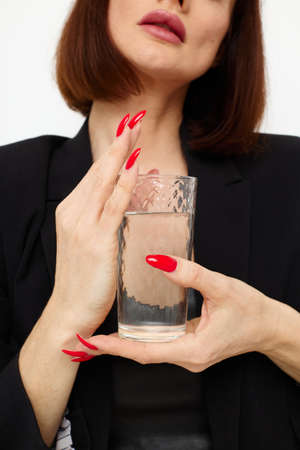 attractive woman in a suit glass of water posing isolated background