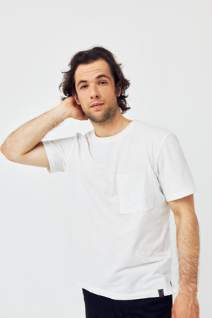 Cheerful man in white t-shirt fashion cropped view isolated backgroundの写真素材