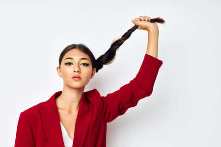 young woman attractive look glamor cosmetics fashion light background unalteredの写真素材