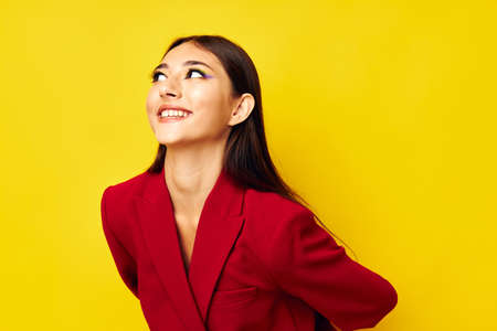 portrait pretty woman attractive look cosmetics red jacket studio model unalteredの写真素材