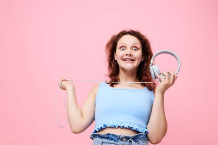 fashionable girl wearing headphones posing dance music unaltered