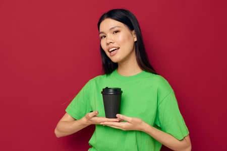 pretty brunette posing in a green t-shirt disposable black glasses Lifestyle unaltered