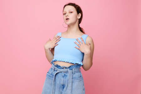 portrait of a young woman blue t shirt hand gestures emotion isolated backgrounds unaltered