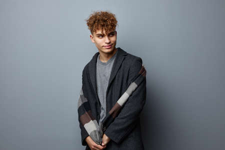 handsome guy elegant style self confidence fashion Gray backgroundの写真素材