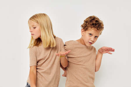 Photo of two children gesticulate with their hands together childhood unaltered