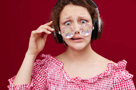 girl wearing headphones glasses in the form of a diamond close-up unaltered