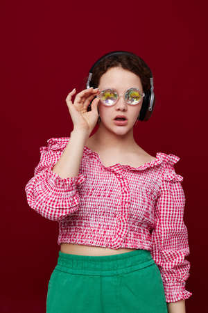 woman with headphones listening to music glasses and diamond fashion
