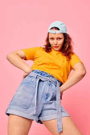 beautiful woman in stylish youth clothes hand gesture fun isolated backgrounds unalteredの写真素材