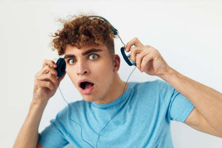 handsome guy in headphones music emotions Lifestyle unalteredの写真素材