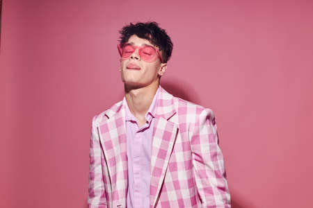 pretty man self confidence pink plaid blazer fashion posing isolated background unalteredの写真素材