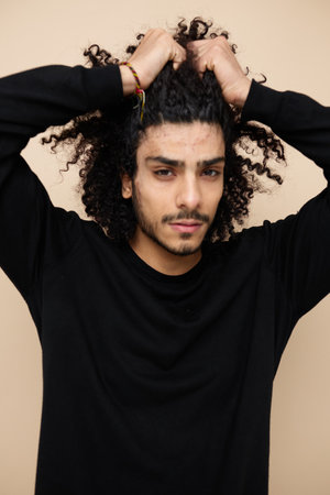 Attractive man in a black sweater hand gesture Lifestyle unalteredの写真素材