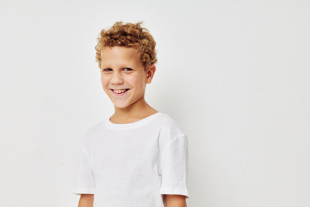 Cute little boy smile in white t-shirt childhood unalteredの写真素材