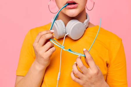 funny girl wearing headphones blue glasses close-up emotions isolated backgrounds unaltered