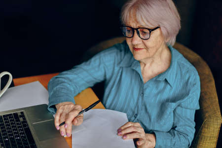 A businesswoman documents work sheet of paper and pen Freelancer works unalteredの写真素材