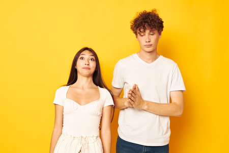 portrait of a man and a woman posing together in white t-shirts friendship Lifestyle unaltered