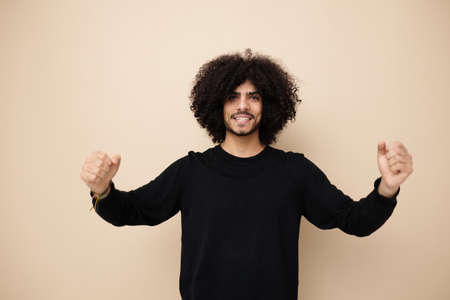 man with curly hair posing fashion modern style Lifestyle unaltered