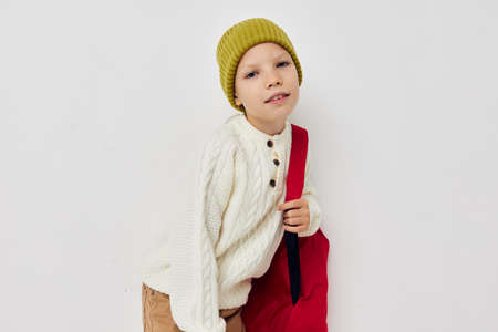 pretty young girl school backpack with a hat on his head childhood unaltered